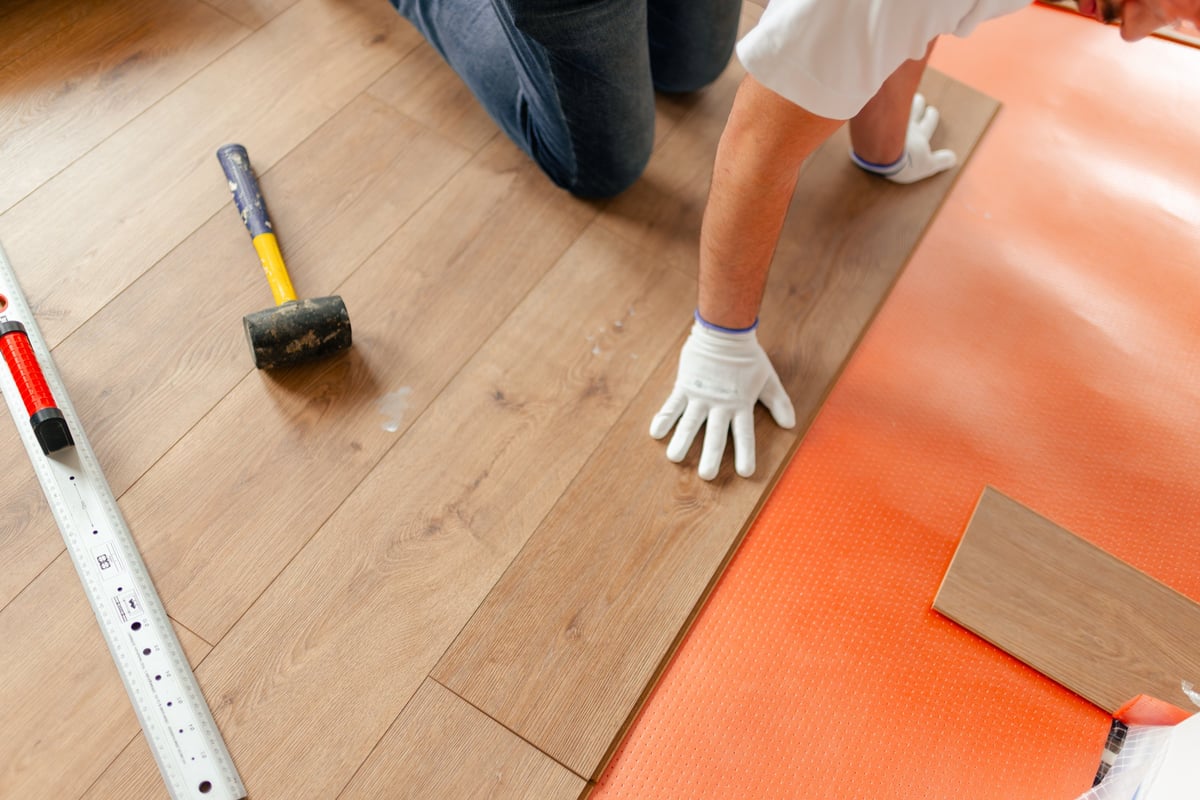 Handyman using a screwdriver on a small home repair